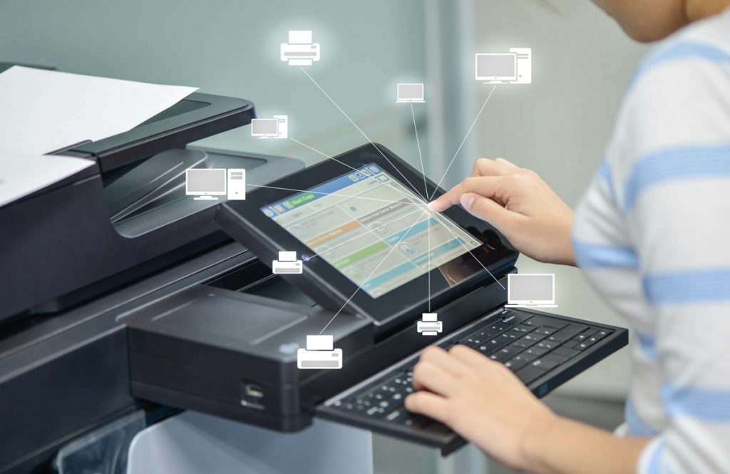 Business woman is using the printer to scanning document to network folder with icon of printer and computer